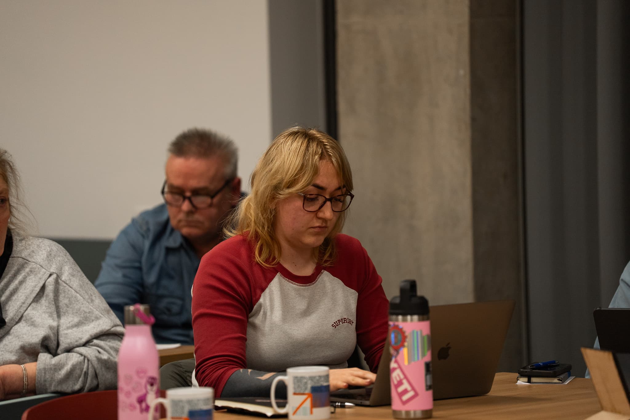 Two participants working through an exercise together on a laptop